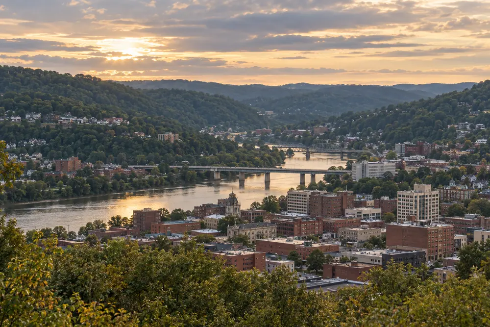 Morgantown rising up the wooded slopes of the Monongahela River valley
